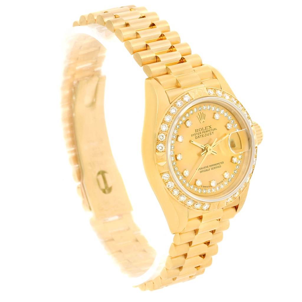 The image shows a side angle of the Rolex President 69158 Women's Yellow Gold Champagne Dial 69158 Women's Yellow Gold Champagne Dial model watch, highlighting its gold bracelet, diamond bezel, and face.