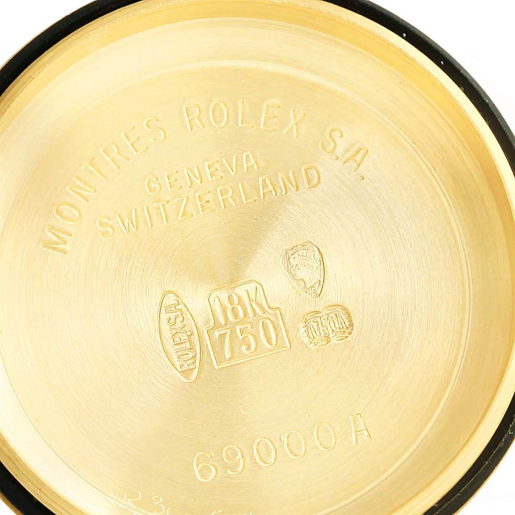 The image shows the inside case back of a Rolex President 69158 Women's Yellow Gold Champagne Dial 69158 Women's Yellow Gold Champagne Dial model watch, displaying branding and gold purity markings.