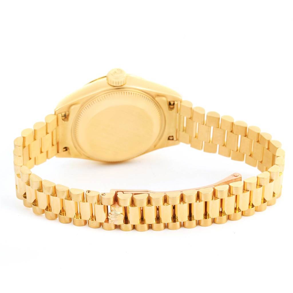 The image shows the back view of a Rolex President 69158 Women's Yellow Gold Champagne Dial 69158 Women's Yellow Gold Champagne Dial model watch, highlighting its gold bracelet and closed case back.