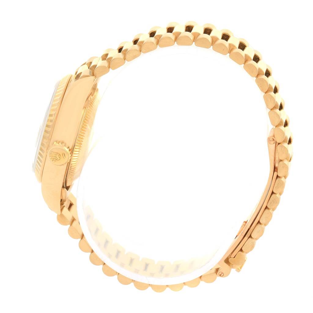 The image shows a Rolex President 69178 Women's Yellow Gold Champagne Dial 69178 Women's Yellow Gold Champagne Dial model watch from a side angle, focusing on the crown, case, and bracelet.