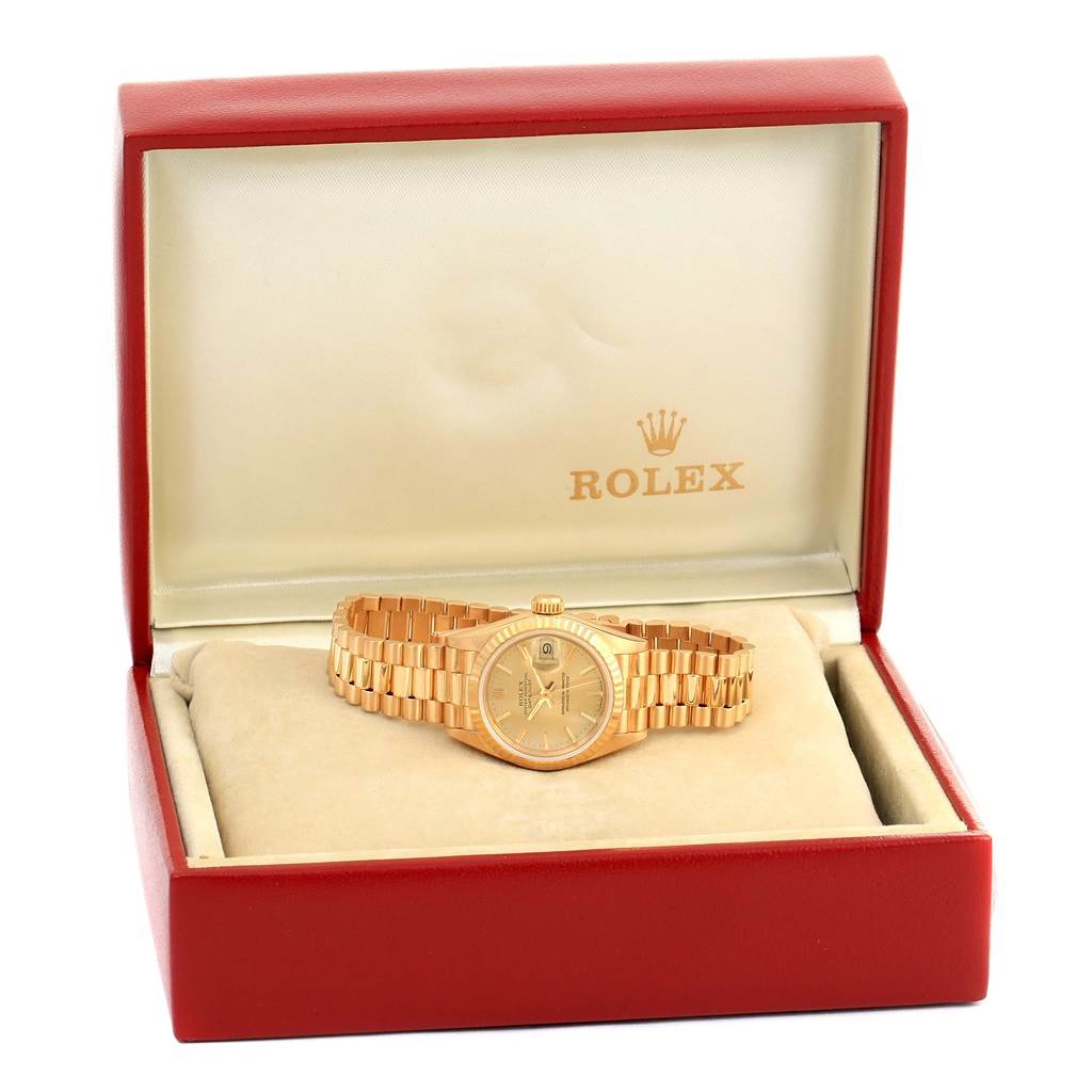 The image shows a Rolex President 69178 Women's Yellow Gold Champagne Dial 69178 Women's Yellow Gold Champagne Dial model watch, displayed in its open red and beige branded box.