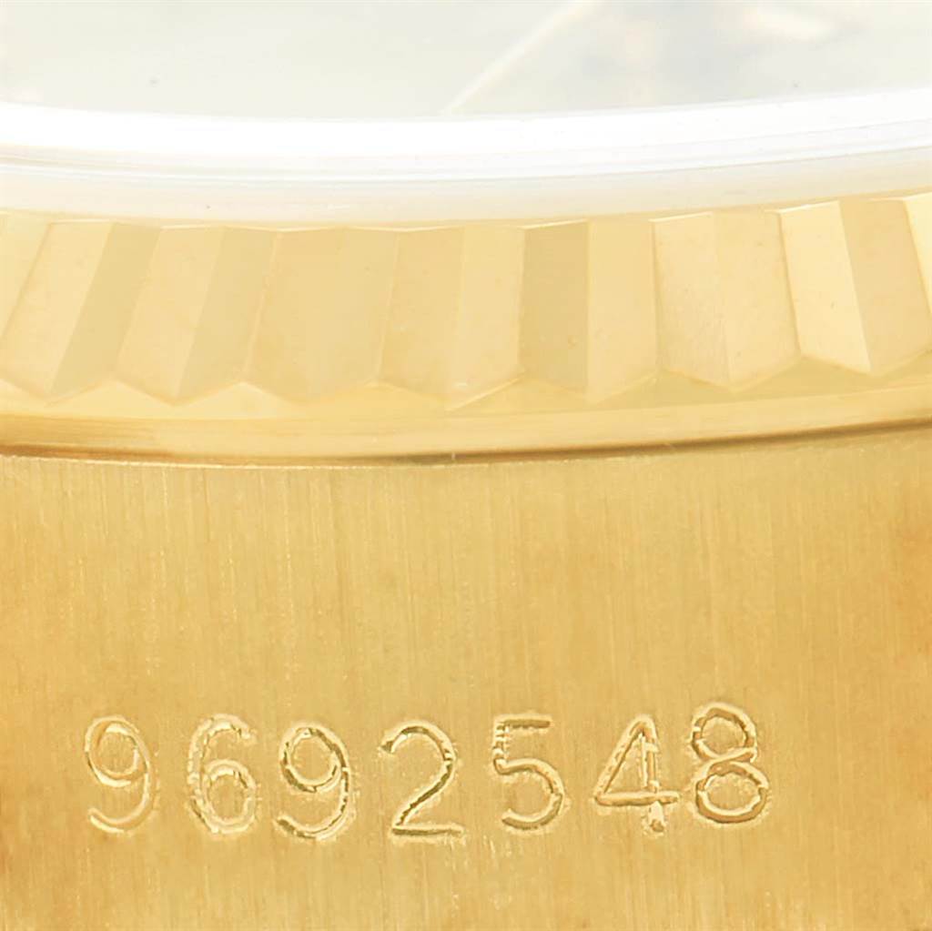 The image shows a close-up of the serial number and the edge of the bezel on a Rolex President 69178 Women's Yellow Gold Champagne Dial 69178 Women's Yellow Gold Champagne Dial model watch.
