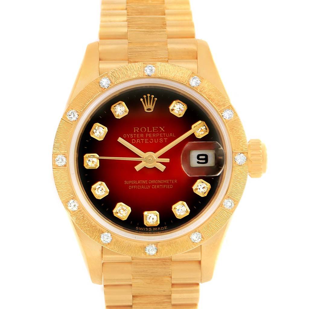 The image shows a Rolex President 79288 Women's Yellow Gold Red Dial 79288 Women's Yellow Gold Red Dial model watch from a frontal angle, highlighting the dial, bezel, crown, and bracelet.