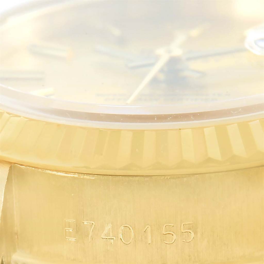 This image shows a close-up of the serial number and edge of the bezel of a Rolex President 69178 Women's Yellow Gold Champagne Dial 69178 Women's Yellow Gold Champagne Dial model watch.
