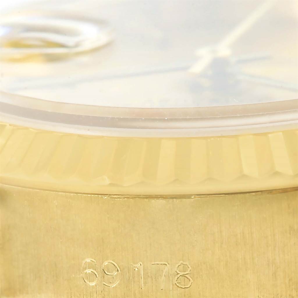 The image shows a close-up of the side of a Rolex President 69178 Women's Yellow Gold Champagne Dial 69178 Women's Yellow Gold Champagne Dial watch, focusing on the bezel and part of the case with the model number 69178.