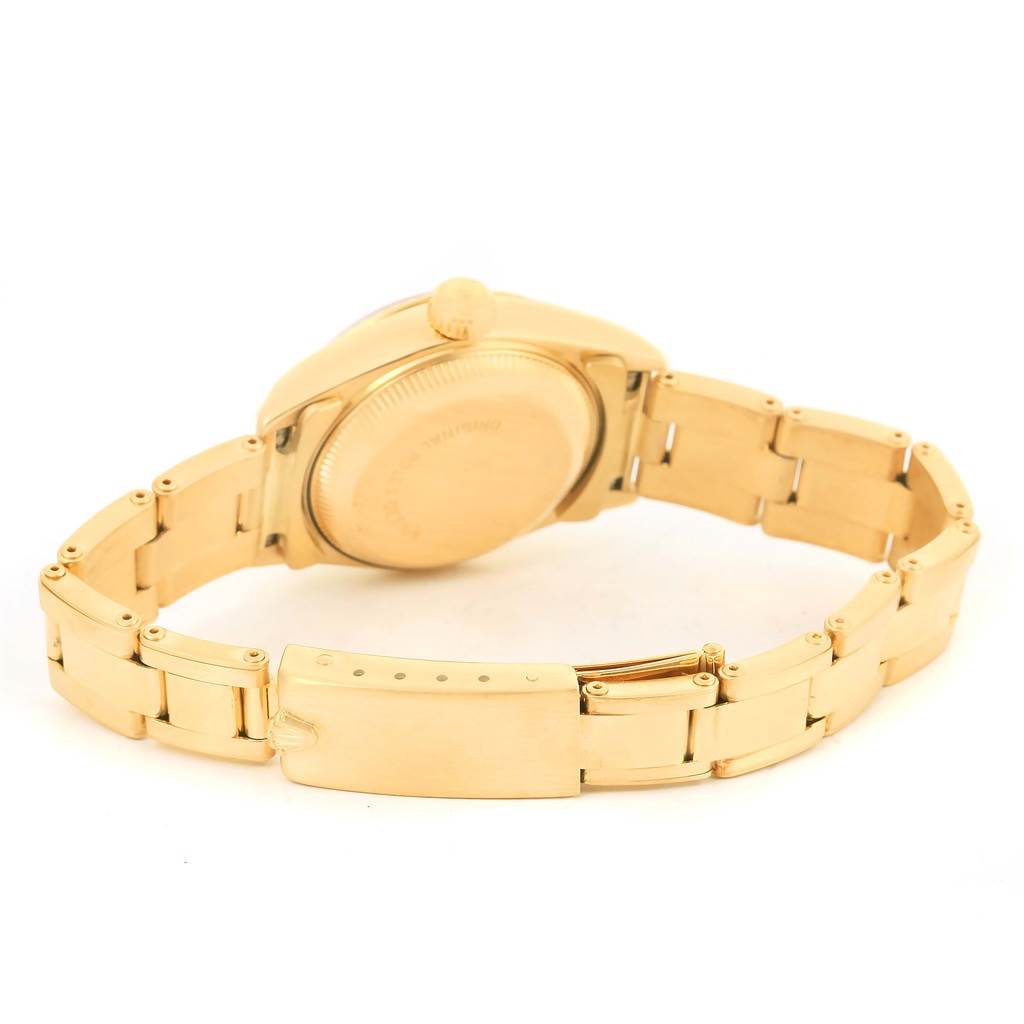 This image shows the back and bracelet of a Rolex President 69178 Women's Yellow Gold Champagne Dial 69178 Women's Yellow Gold Champagne Dial watch from a slightly elevated rear angle.