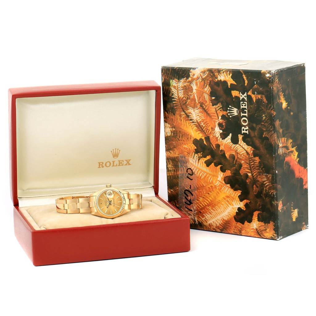 The Rolex President 69178 Women's Yellow Gold Champagne Dial 69178 Women's Yellow Gold Champagne Dial model watch is shown from a front angle, placed in an open red box with an outer decorative box.