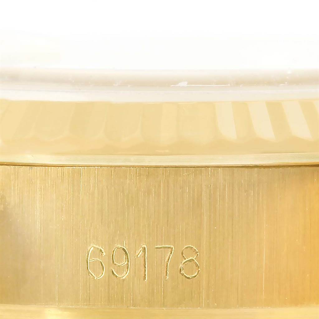 This is a close-up of the case side of a Rolex President 69178 Women's Yellow Gold White Dial 69178 Women's Yellow Gold White Dial model watch, showing the engraved model number "69178."