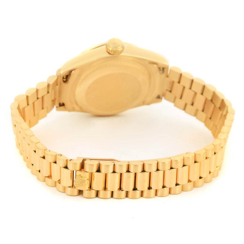 The image shows the back view of a Rolex President 69178 Women's Yellow Gold White Dial 69178 Women's Yellow Gold White Dial model watch, highlighting its case back and gold bracelet.