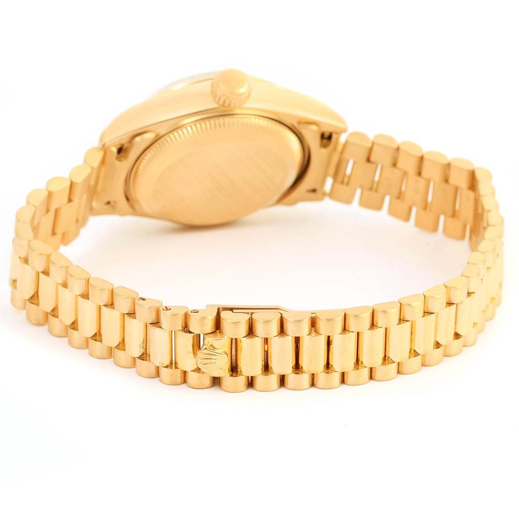 The image shows the back view of a Rolex President 69178 Women's Yellow Gold Champagne Dial 69178 Women's Yellow Gold Champagne Dial model watch, highlighting the gold case, bracelet, and clasp.