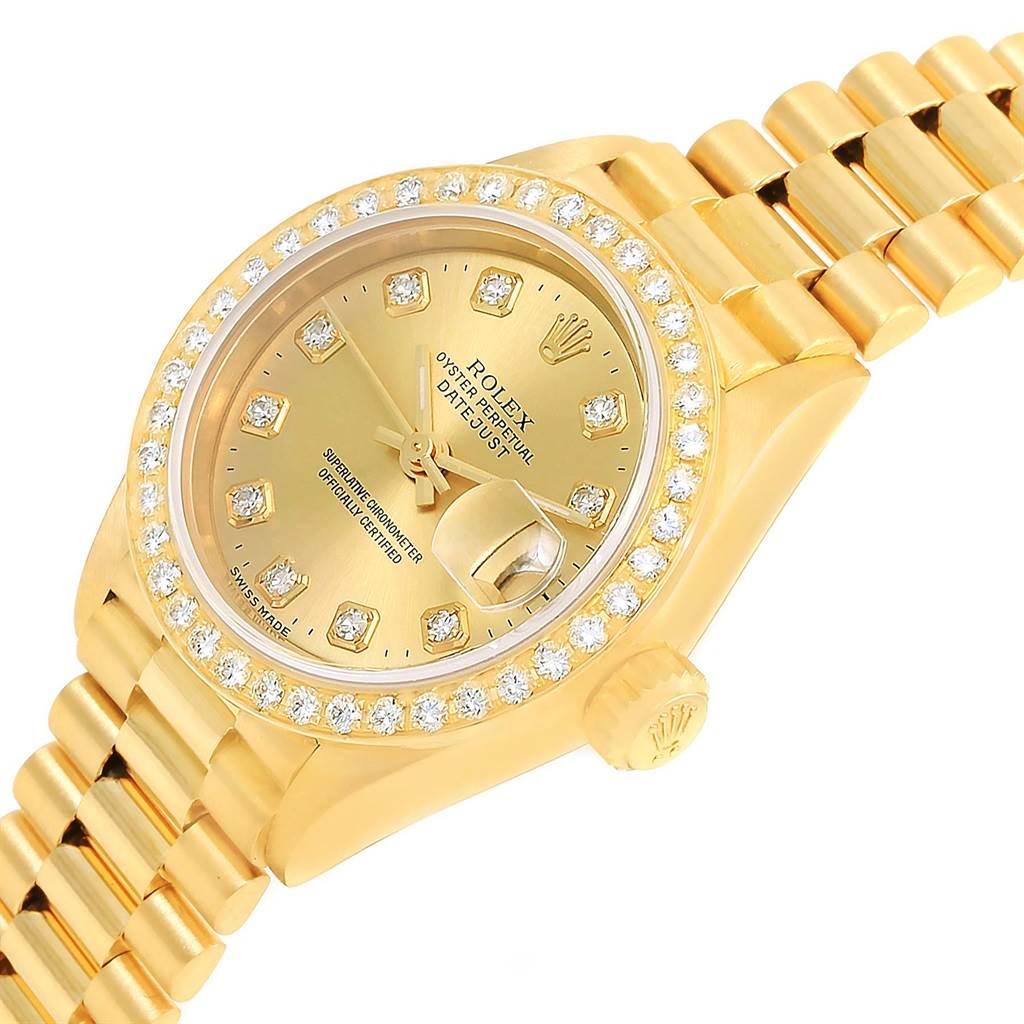 The image shows a gold Rolex President 69178 Women's Yellow Gold Champagne Dial 69178 Women's Yellow Gold Champagne Dial model watch angled slightly to the side, highlighting its diamond bezel and bracelet.