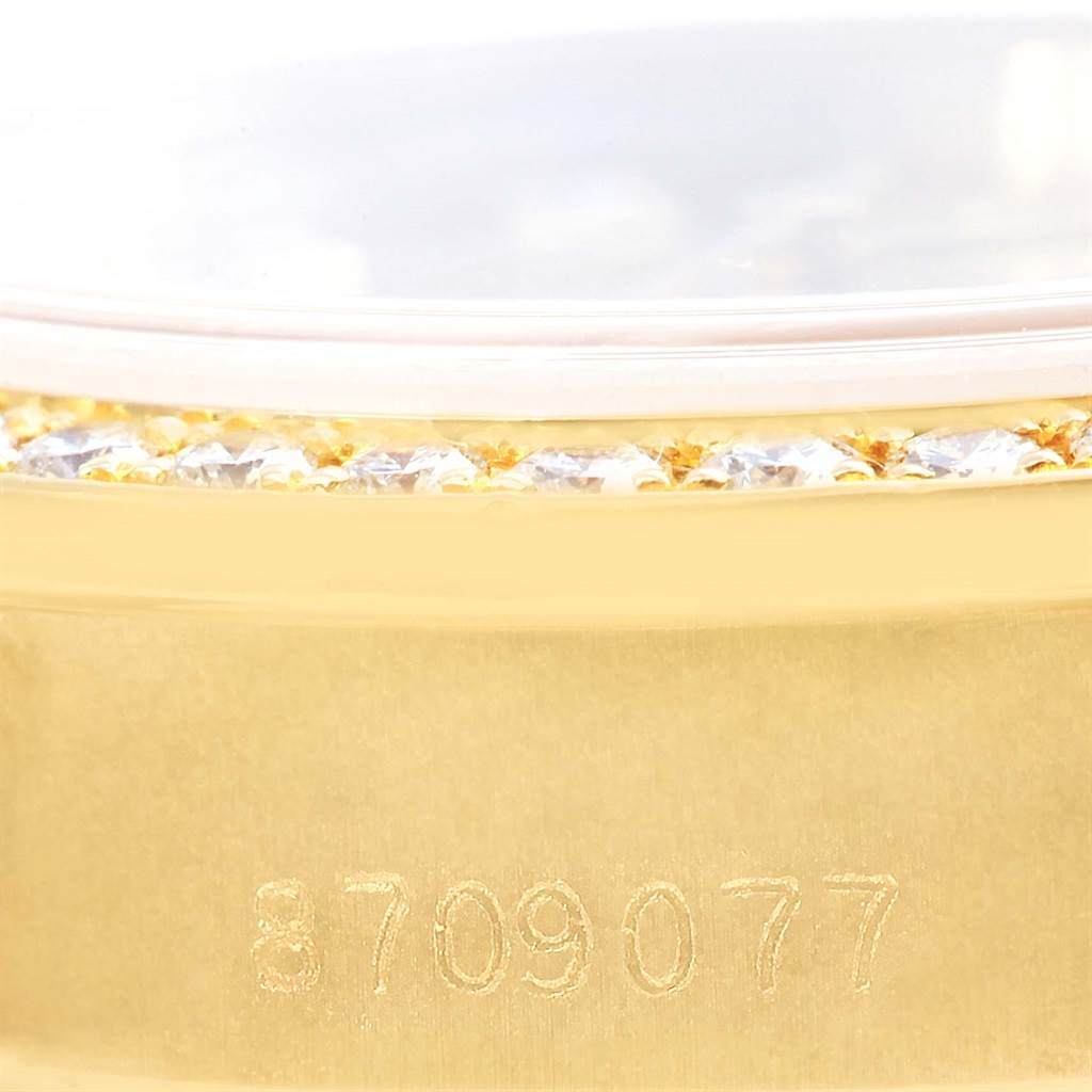 This close-up image of a Rolex President 69178 Women's Yellow Gold Champagne Dial 69178 Women's Yellow Gold Champagne Dial model shows part of the case with diamond detailing and a partial serial number.