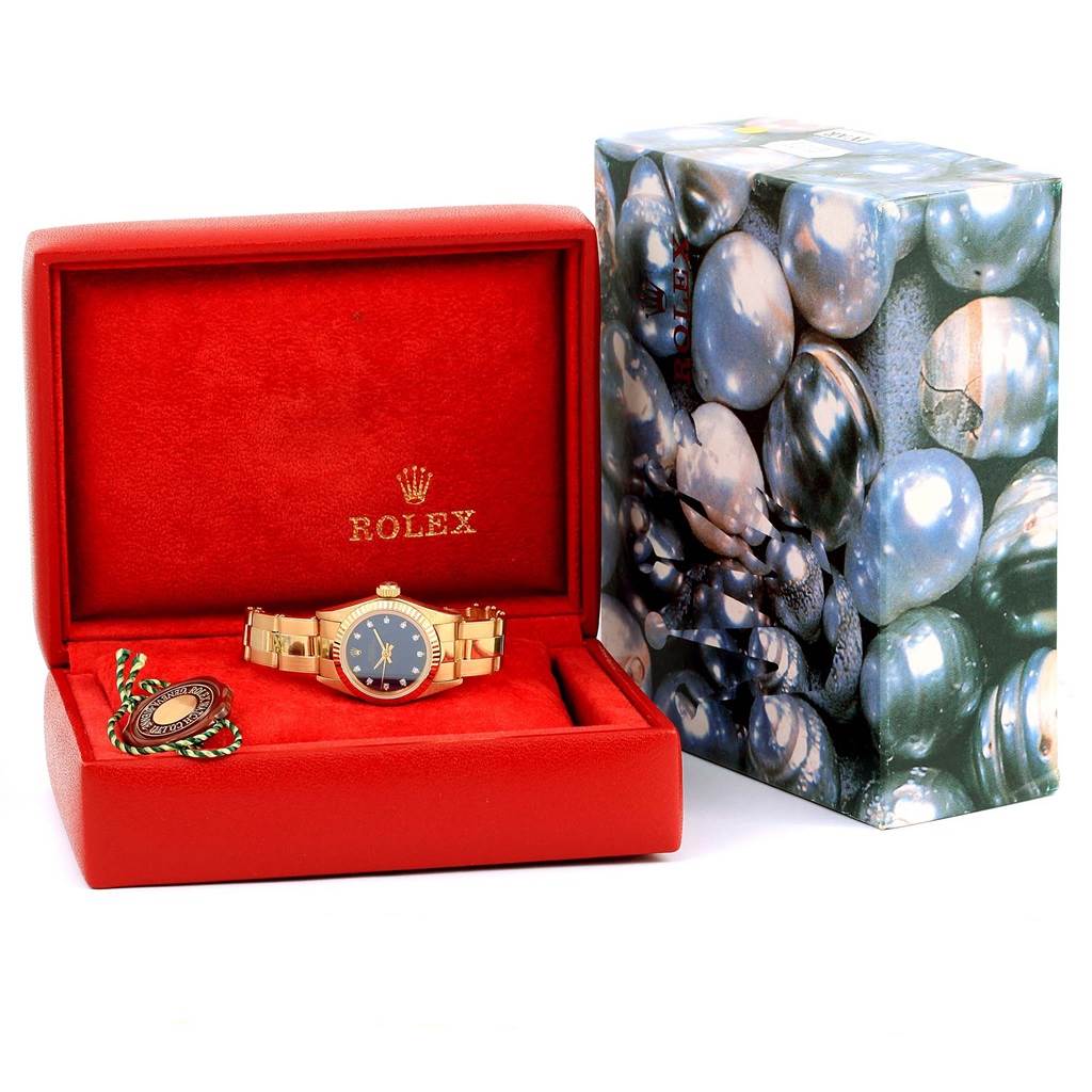 The image shows a Rolex President 67198 Women's Yellow Gold Blue Dial 67198 Women's Yellow Gold Blue Dial model watch in a red box with accessories, viewed from the front.