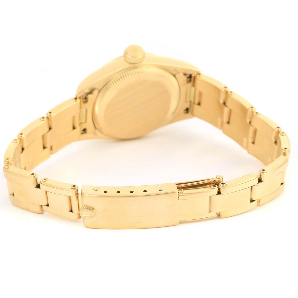 The image shows the back and the bracelet clasp of a Rolex President 67198 Women's Yellow Gold Blue Dial 67198 Women's Yellow Gold Blue Dial model watch at an angled rear view.