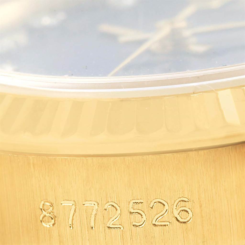 The image shows a close-up angle of the case and serial number on a Rolex President 67198 Women's Yellow Gold Blue Dial 67198 Women's Yellow Gold Blue Dial model.
