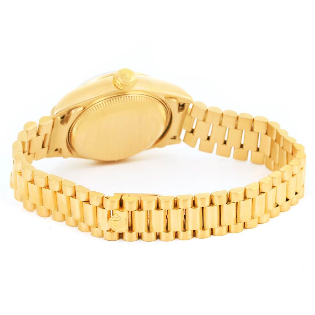 The image shows the back view of the Rolex President 69178 Women
s Yellow Gold Champagne Dial 69178 Women
s Yellow Gold Champagne Dial model watch, highlighting the case back and the President bracelet.