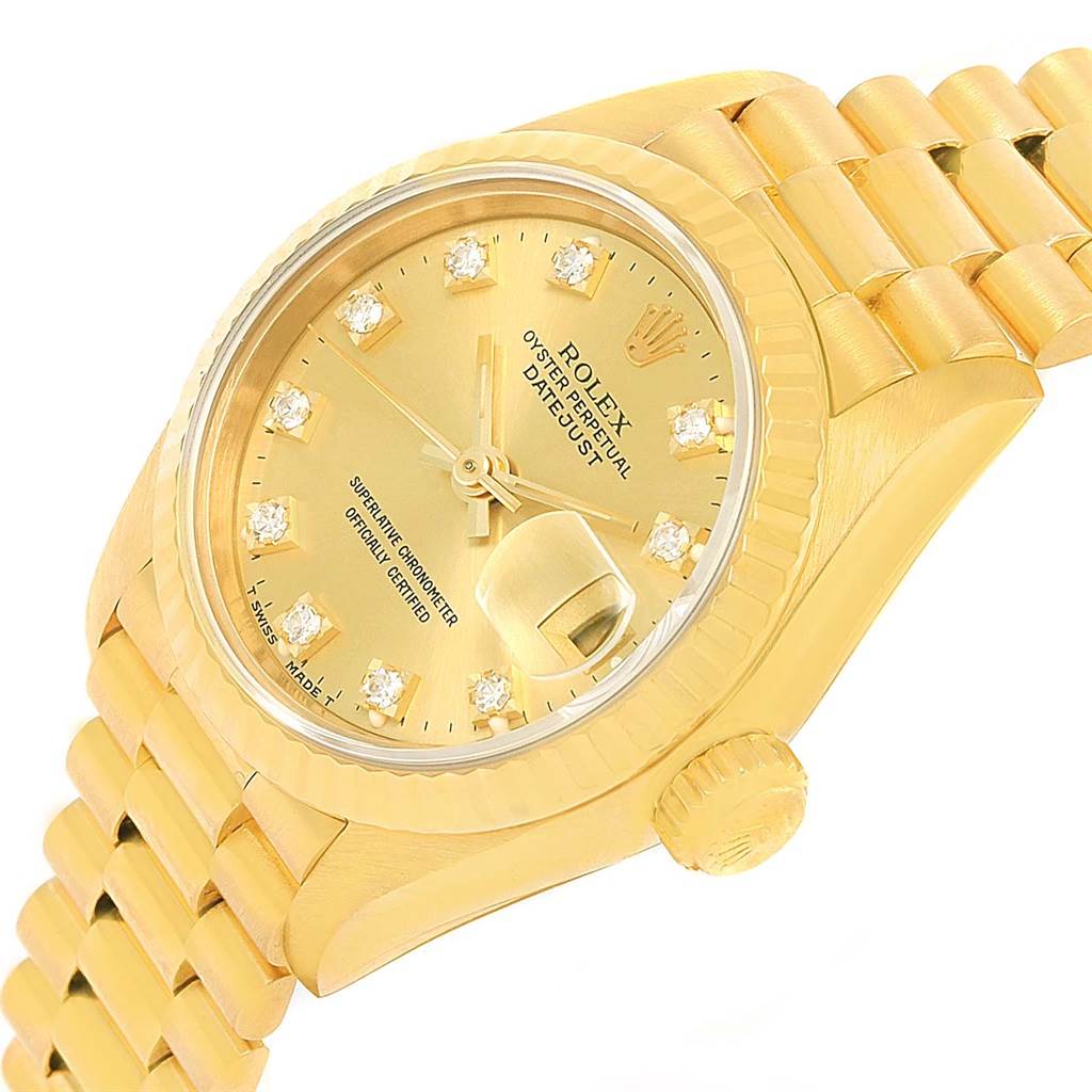 This image shows a side angle of a gold Rolex President 69178 Women
s Yellow Gold Champagne Dial 69178 Women
s Yellow Gold Champagne Dial model, highlighting the dial, crown, bracelet, and diamond hour markers.