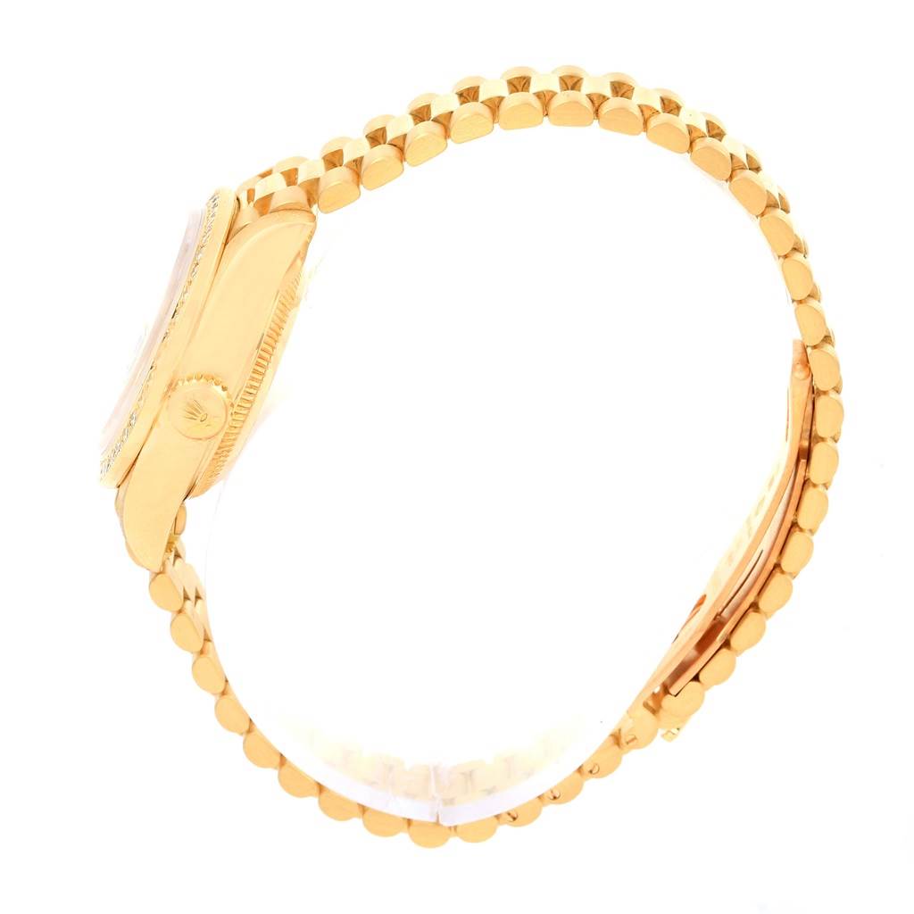 The image shows a side profile of a Rolex President 69138 Women
s Yellow Gold White Dial 69138 Women
s Yellow Gold White Dial model watch, highlighting the case, crown, and bracelet.