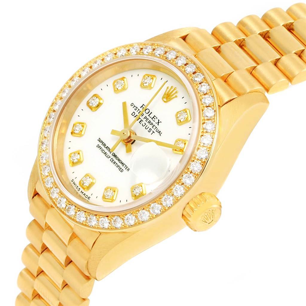 This image shows the front and side view of a gold Rolex President 69138 Women
s Yellow Gold White Dial 69138 Women
s Yellow Gold White Dial model watch, displaying its face, bezel, and part of its bracelet.