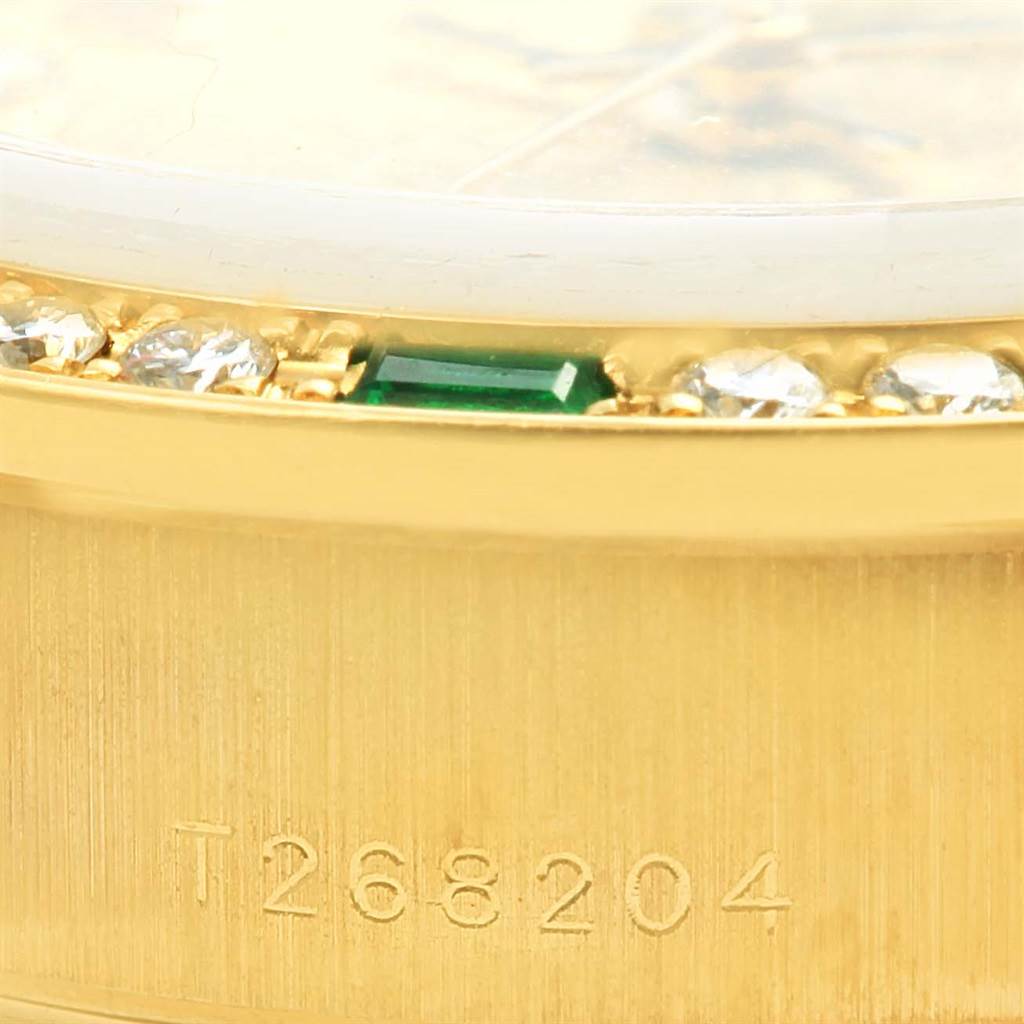 The image shows a close-up of the bezel and side of the Rolex President 69078 Women's Yellow Gold Champagne Dial 69078 Women's Yellow Gold Champagne Dial model watch, highlighting gemstones and engraved reference numbers.