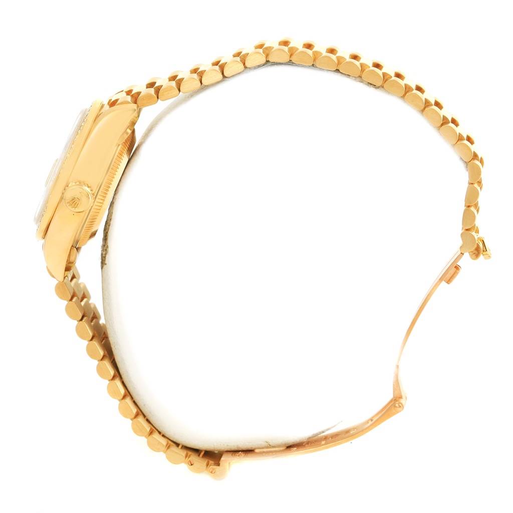 The image shows a side view of a Rolex President 69078 Women's Yellow Gold Champagne Dial 69078 Women's Yellow Gold Champagne Dial model watch, highlighting its gold bracelet and case.