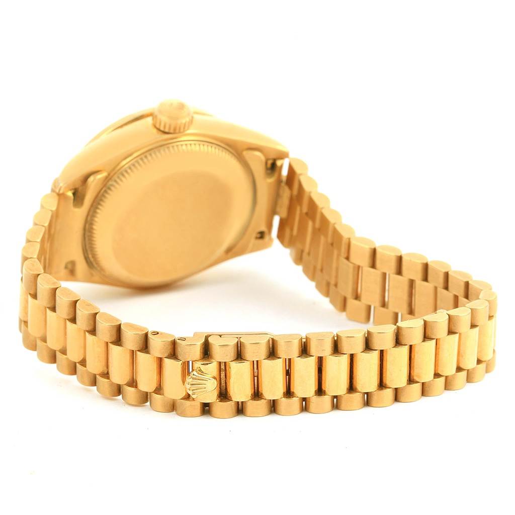 This image shows the back case and bracelet of a Rolex President 69158 Women's Yellow Gold Champagne Dial 69158 Women's Yellow Gold Champagne Dial model watch from an angled rear view.