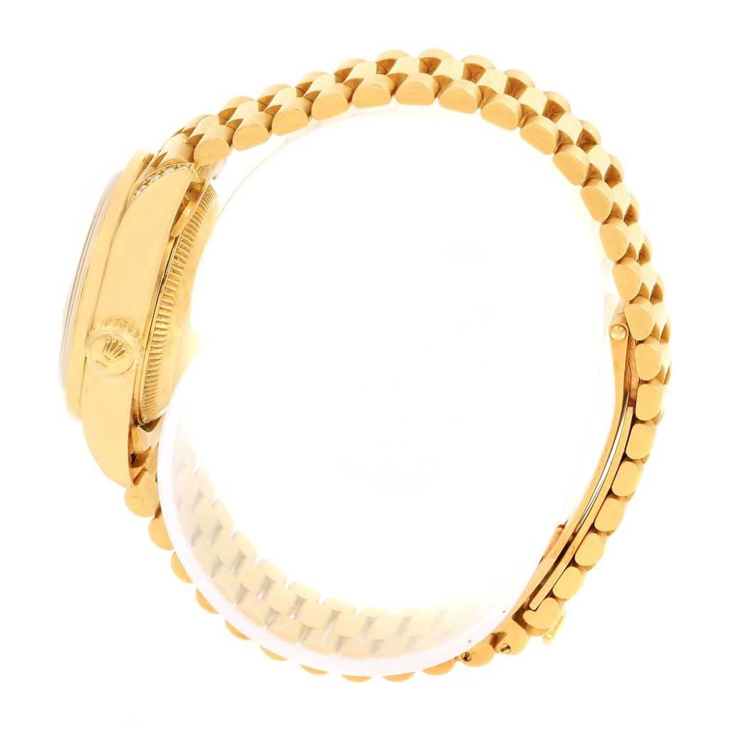 The image shows a Rolex President 69158 Women's Yellow Gold Champagne Dial 69158 Women's Yellow Gold Champagne Dial model watch from the side, highlighting the gold case, crown, and Jubilee bracelet.