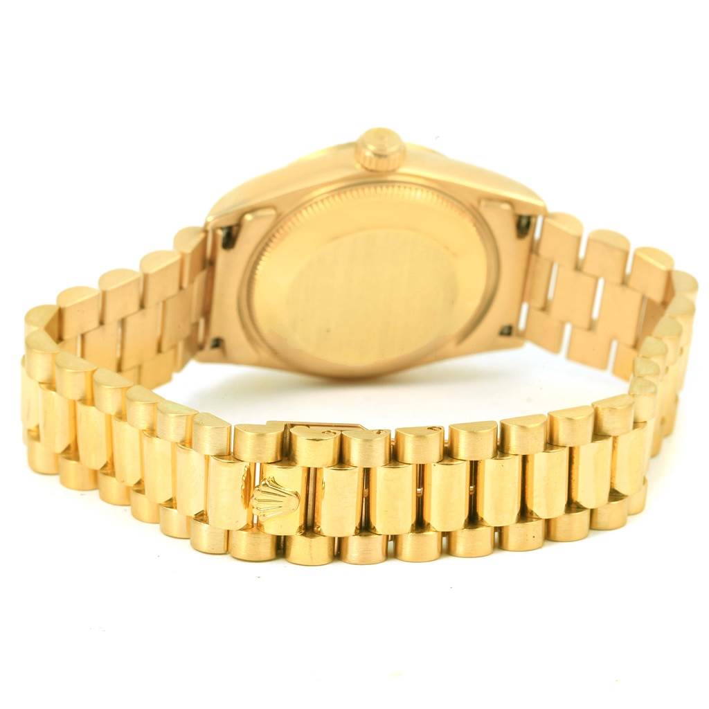 This image shows the back case and bracelet of a Rolex President 68278 Women's Yellow Gold Beige Dial 68278 Women's Yellow Gold Beige Dial model, viewed from the backside.