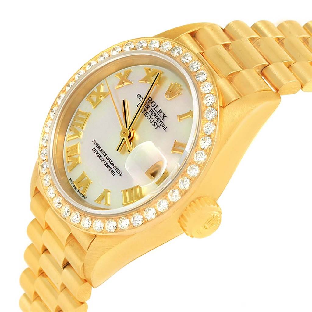 This image shows a gold Rolex President 79178 Women's Yellow Gold Mother of Pearl Dial 79178 Women's Yellow Gold Mother of Pearl Dial model watch, tilted at an angle highlighting the diamond bezel, dial, and part of the bracelet.
