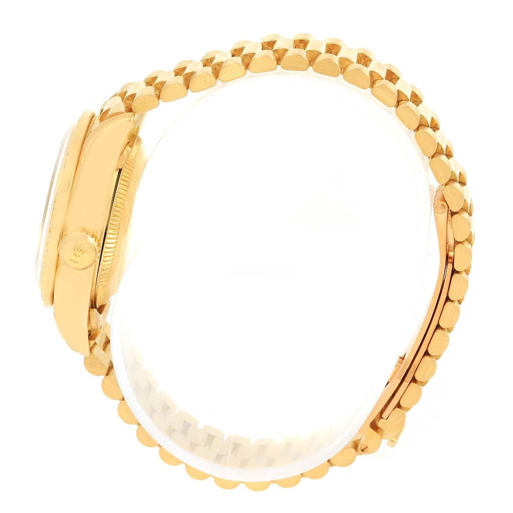 This image shows a side view of the Rolex President 79178 Women's Yellow Gold Mother of Pearl Dial 79178 Women's Yellow Gold Mother of Pearl Dial model focusing on the crown, bezel, and gold bracelet.