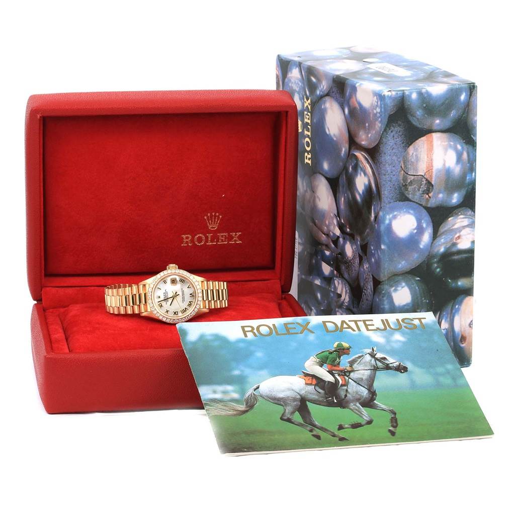 The Rolex President 79178 Women's Yellow Gold Mother of Pearl Dial 79178 Women's Yellow Gold Mother of Pearl Dial model watch is shown inside its open red box, accompanied by an outer box and a Rolex Datejust booklet.