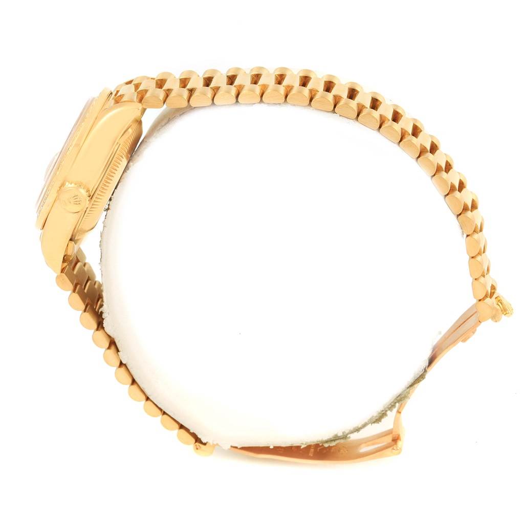 The image shows a side view of the Rolex President 69138 Women's Yellow Gold Champagne Dial 69138 Women's Yellow Gold Champagne Dial model watch, highlighting its case, crown, and bracelet.