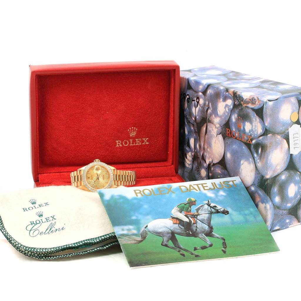 The image shows a Rolex President 69138 Women's Yellow Gold Champagne Dial 69138 Women's Yellow Gold Champagne Dial model watch in its box along with accessories, cleaning cloth, and a Rolex Datejust booklet.