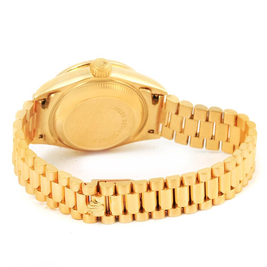 The image shows the back case and bracelet of the Rolex President 69138 Women's Yellow Gold Champagne Dial 69138 Women's Yellow Gold Champagne Dial model watch, viewed from an angled rear perspective.