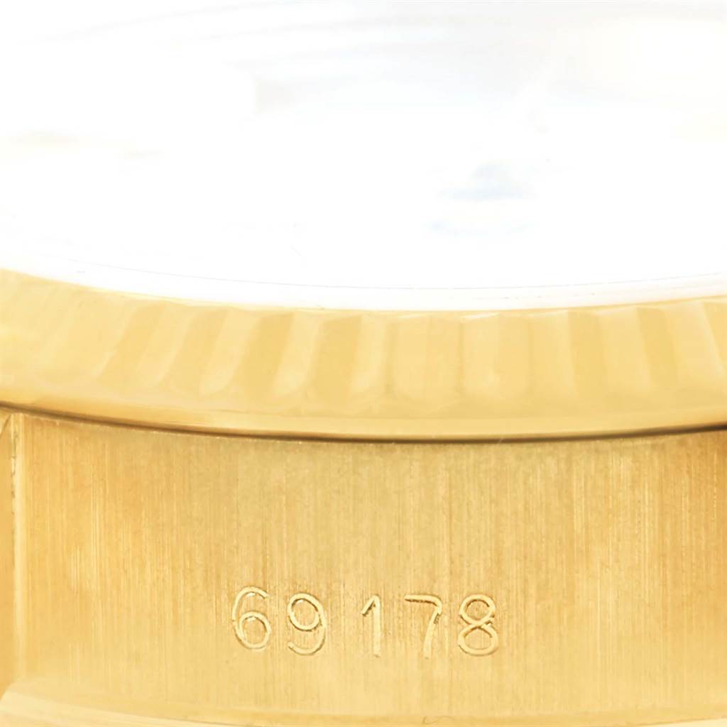 The image shows a close-up of a Rolex President 69178 Women's Yellow Gold White Dial 69178 Women's Yellow Gold White Dial model, detailing the side case with the engraved model number 69178.