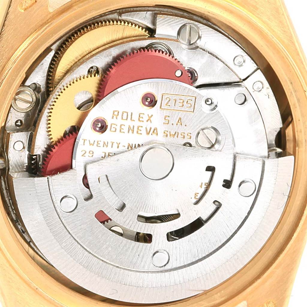 The image shows a close-up of the Rolex President 69178 Women's Yellow Gold White Dial 69178 Women's Yellow Gold White Dial model's movement, showcasing the intricate inner gears and mechanism.