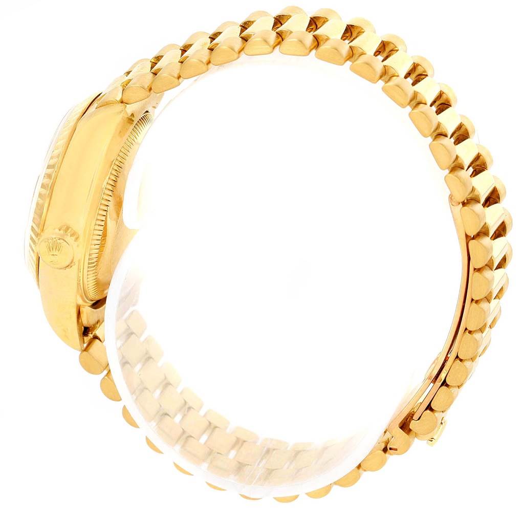 The image shows a side view of a Rolex President 69178 Women's Yellow Gold White Dial 69178 Women's Yellow Gold White Dial model watch, highlighting its gold case and band.