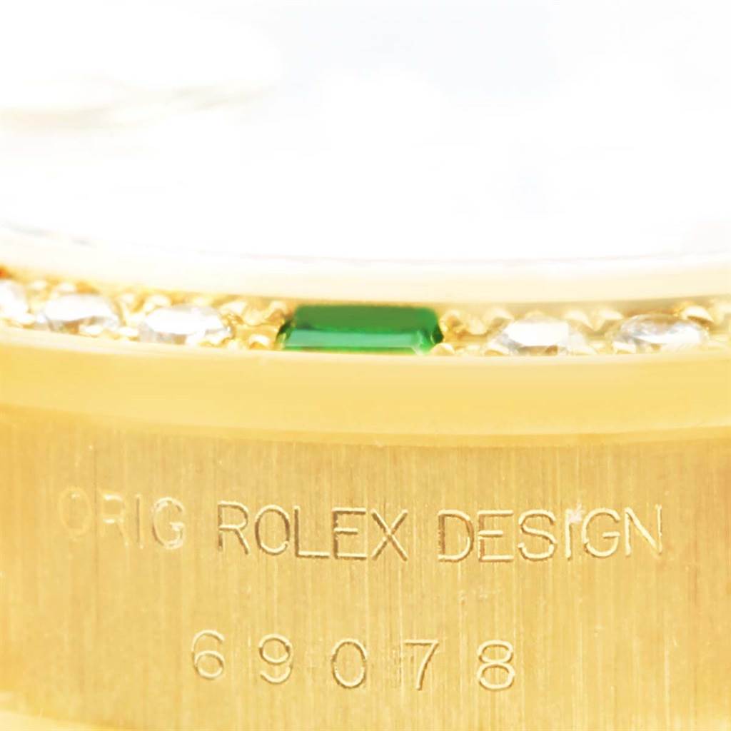 This image shows a close-up of the Rolex President 69078 Women's Yellow Gold Champagne Dial 69078 Women's Yellow Gold Champagne Dial model with the "ORIG ROLEX DESIGN" engraving and model number 69078.
