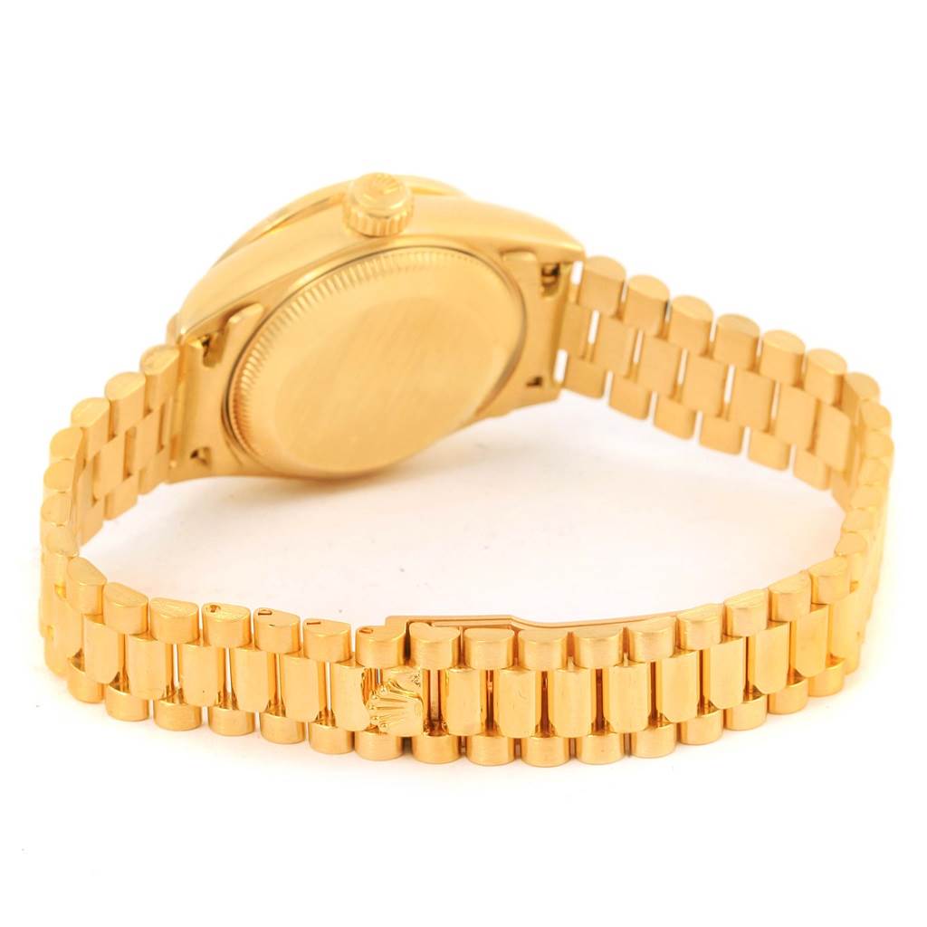 This image shows the back view of a Rolex President 69078 Women's Yellow Gold Champagne Dial 69078 Women's Yellow Gold Champagne Dial model watch, highlighting the gold bracelet and case.