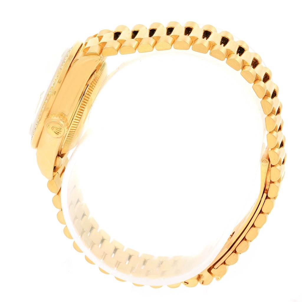 The image shows a side view of the Rolex President 69138 Women's Yellow Gold Champagne Dial 69138 Women's Yellow Gold Champagne Dial model watch, highlighting its bezel, crown, and gold bracelet.