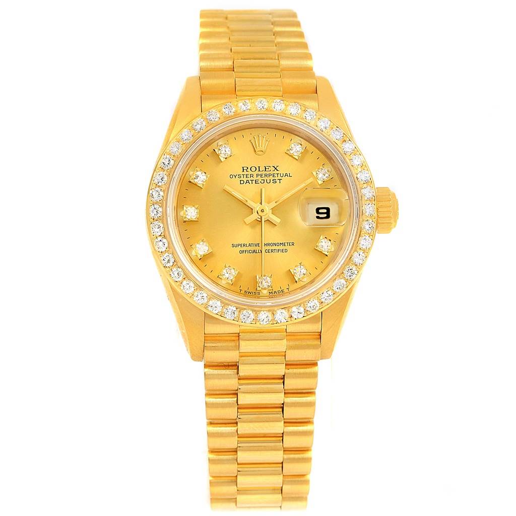 The image shows a front view of a Rolex President 69138 Women's Yellow Gold Champagne Dial 69138 Women's Yellow Gold Champagne Dial model watch, featuring a gold band, diamond bezel, and date display.