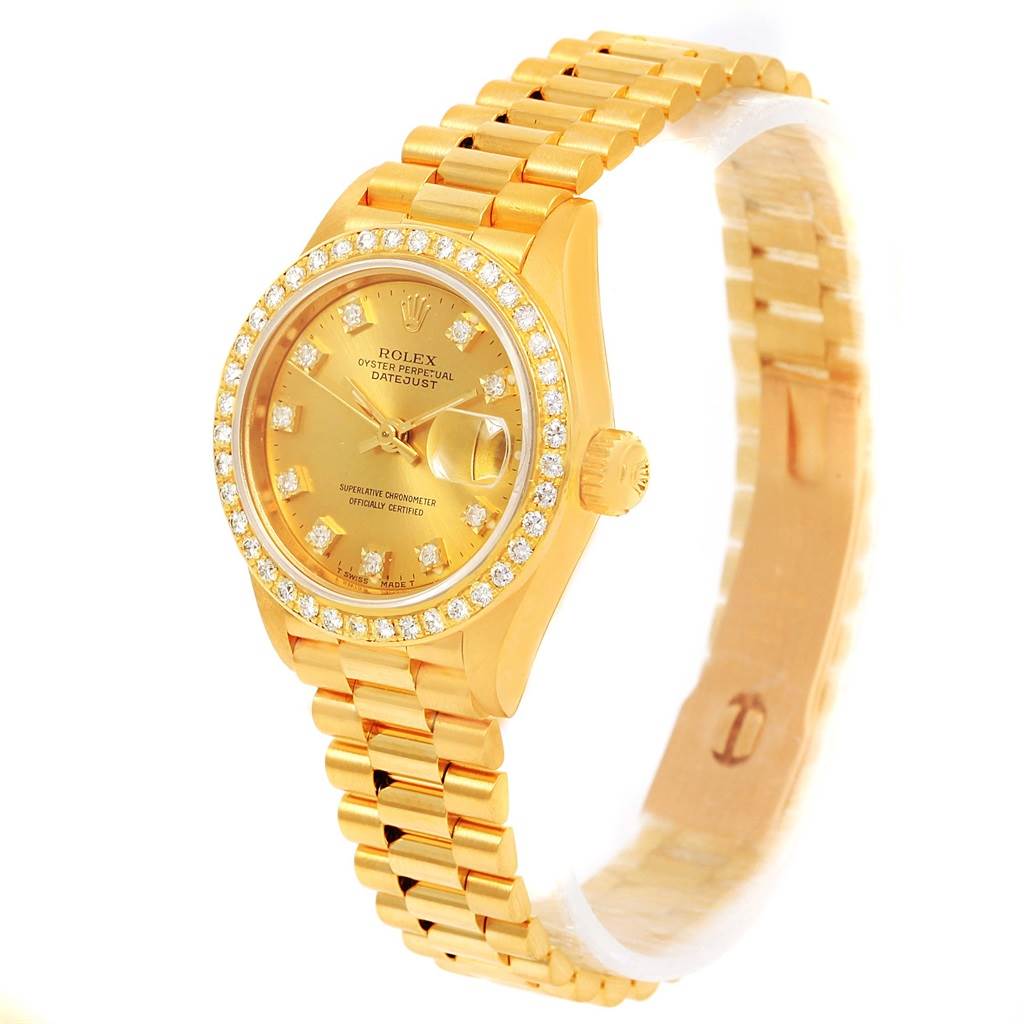 This image shows a Rolex President 69138 Women's Yellow Gold Champagne Dial 69138 Women's Yellow Gold Champagne Dial model watch angled to display the face, bezel, crown, and partial bracelet.