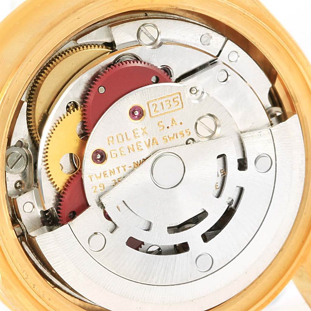This image shows the internal mechanical movement of a Rolex President 69138 Women's Yellow Gold Champagne Dial 69138 Women's Yellow Gold Champagne Dial watch, highlighting gears and the rotor.