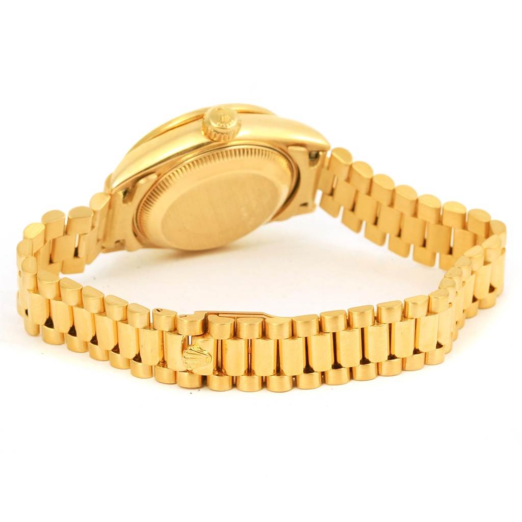 The image shows the back case and bracelet of a Rolex President 69138 Women's Yellow Gold Champagne Dial 69138 Women's Yellow Gold Champagne Dial model watch from a slightly angled rear view.