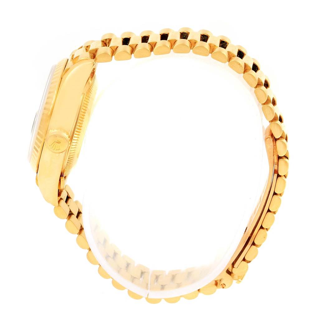 The image shows a side view of a Rolex President 69178 Women's Yellow Gold Black Dial 69178 Women's Yellow Gold Black Dial model watch, highlighting its gold case and bracelet.