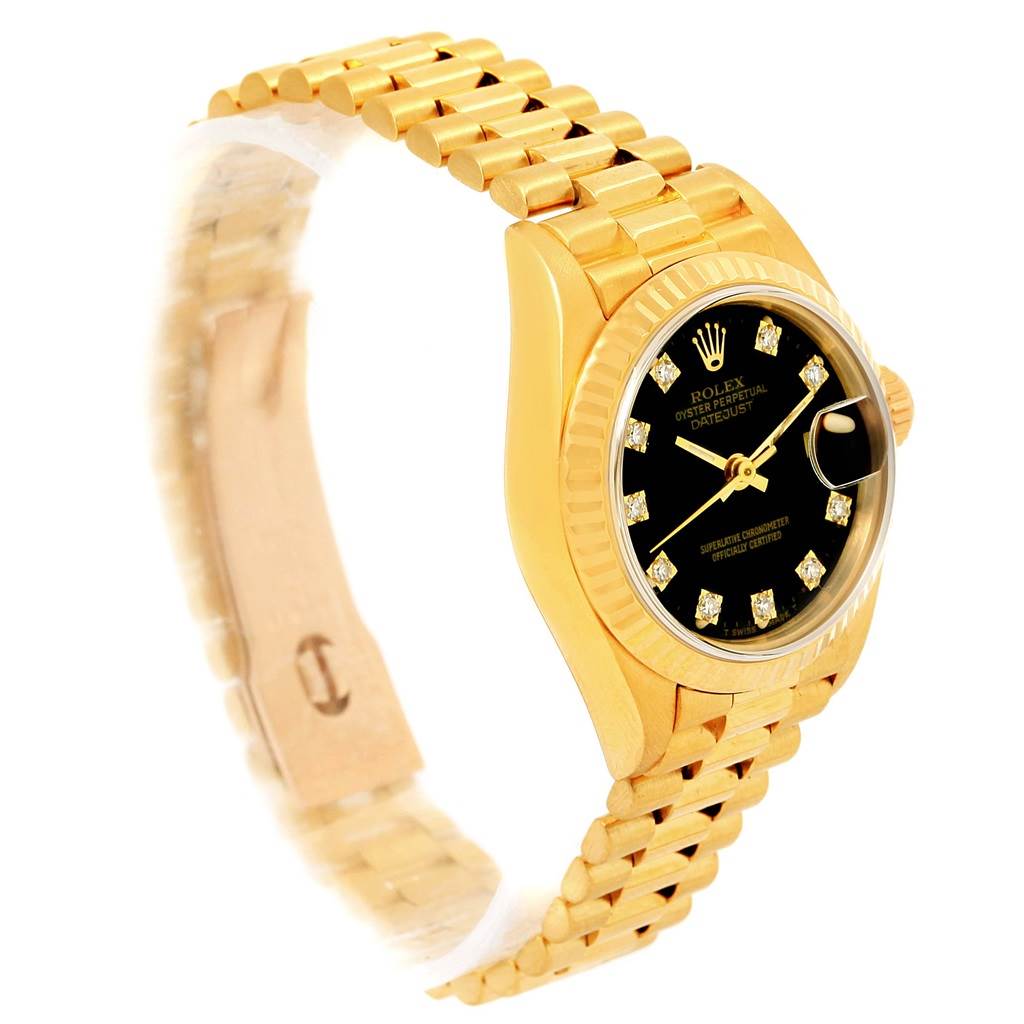 The image shows a Rolex President 69178 Women's Yellow Gold Black Dial 69178 Women's Yellow Gold Black Dial model watch at a slight angle, highlighting its gold bracelet, black dial, and diamond hour markers.