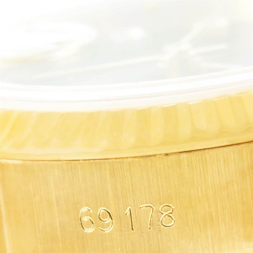 The image shows a close-up of the case side and serial number of a Rolex President 69178 Women's Yellow Gold Black Dial 69178 Women's Yellow Gold Black Dial model watch, showing "69178".