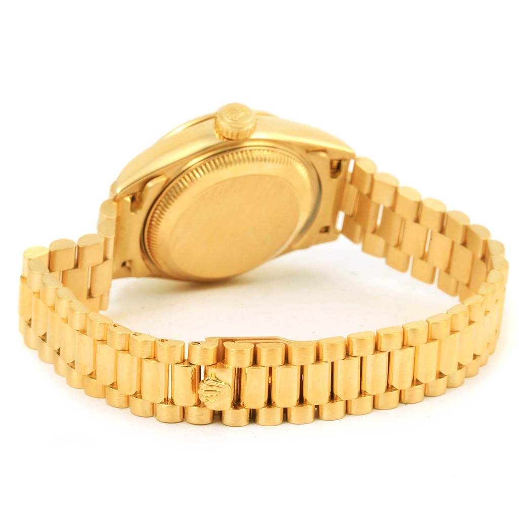 The image shows the back case and bracelet of a Rolex President 79258 Women's Yellow Gold White Dial 79258 Women's Yellow Gold White Dial model watch from a rear angle.