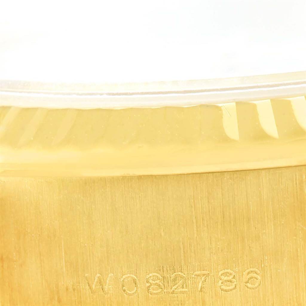 This close-up image shows the case side with the serial number of a Rolex President 79258 Women's Yellow Gold White Dial 79258 Women's Yellow Gold White Dial model.