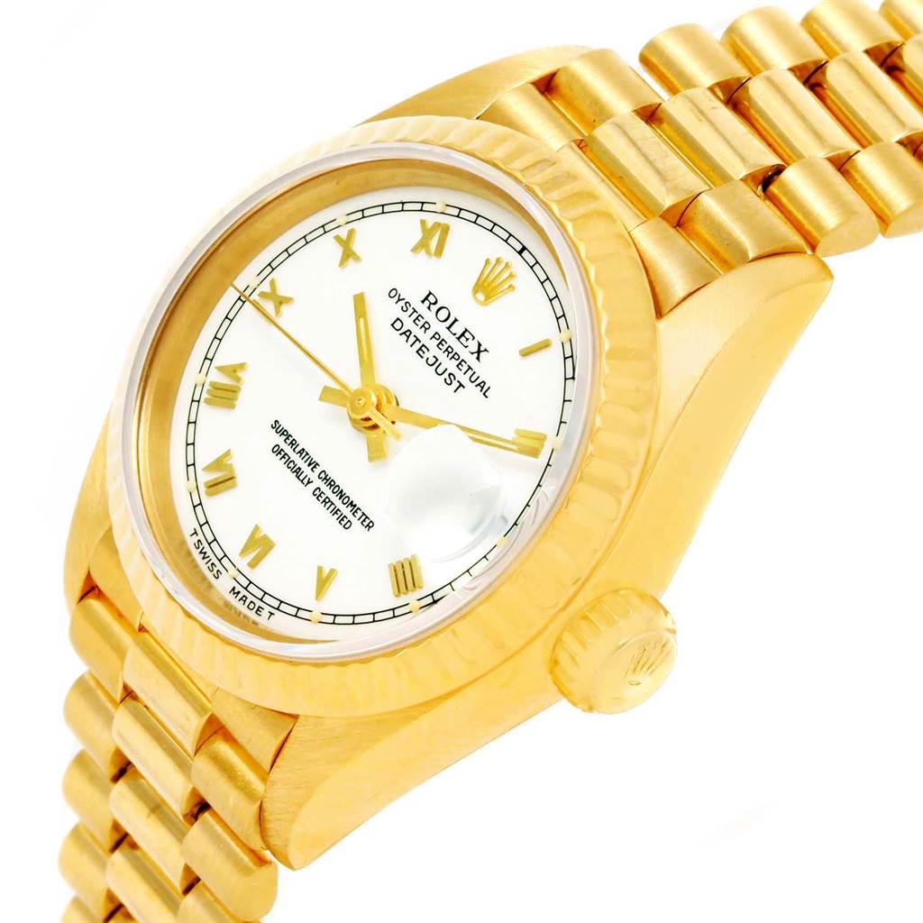The image shows a close-up side angle of a Rolex President 79258 Women's Yellow Gold White Dial 79258 Women's Yellow Gold White Dial model watch, highlighting the gold case, crown, bracelet, and dial.